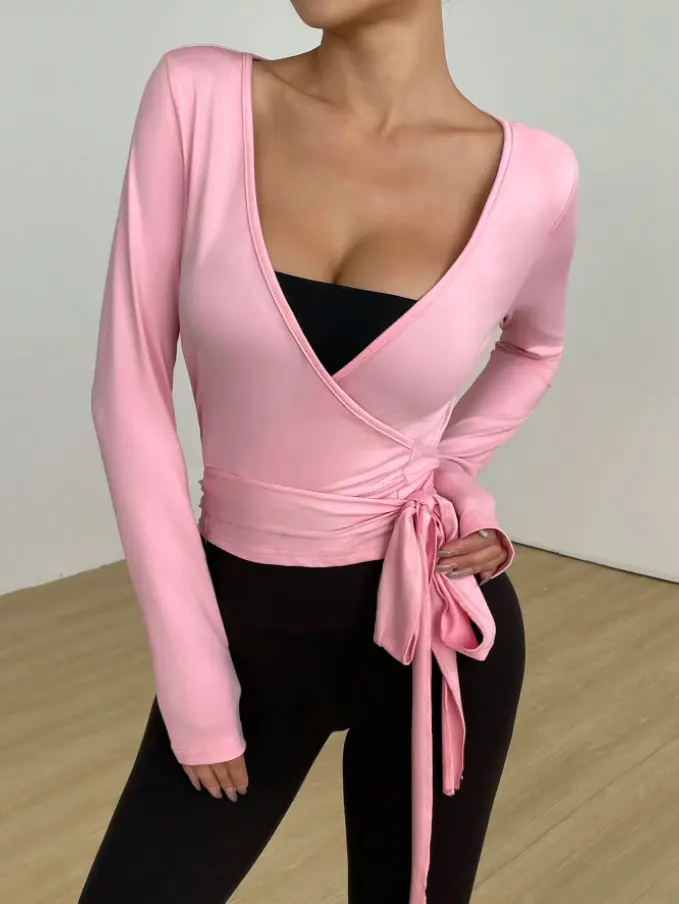 Pink women's wrap long sleeve active top, front view